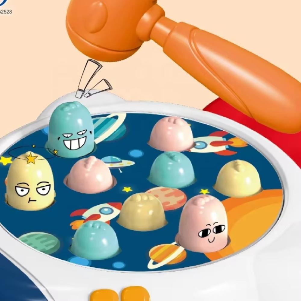 Close-up of rocket-themed pounding board with planet graphics and pop-up targets