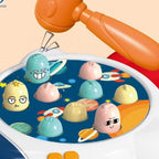 Close-up of rocket-themed pounding board with planet graphics and pop-up targets