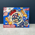 Space rocket whack-a-mole toy game board with two yellow mallets